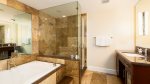 Luxury master ensuite with spa tub and separate glassed shower